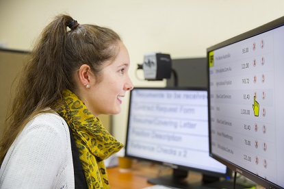 Image shows VA client caroline using a computer with screen magnification