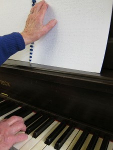 Braille music ontop of a piano