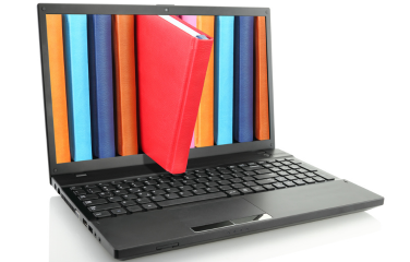 A red book popping out of a laptop screen, with multiple colorful books still visible on the screen.