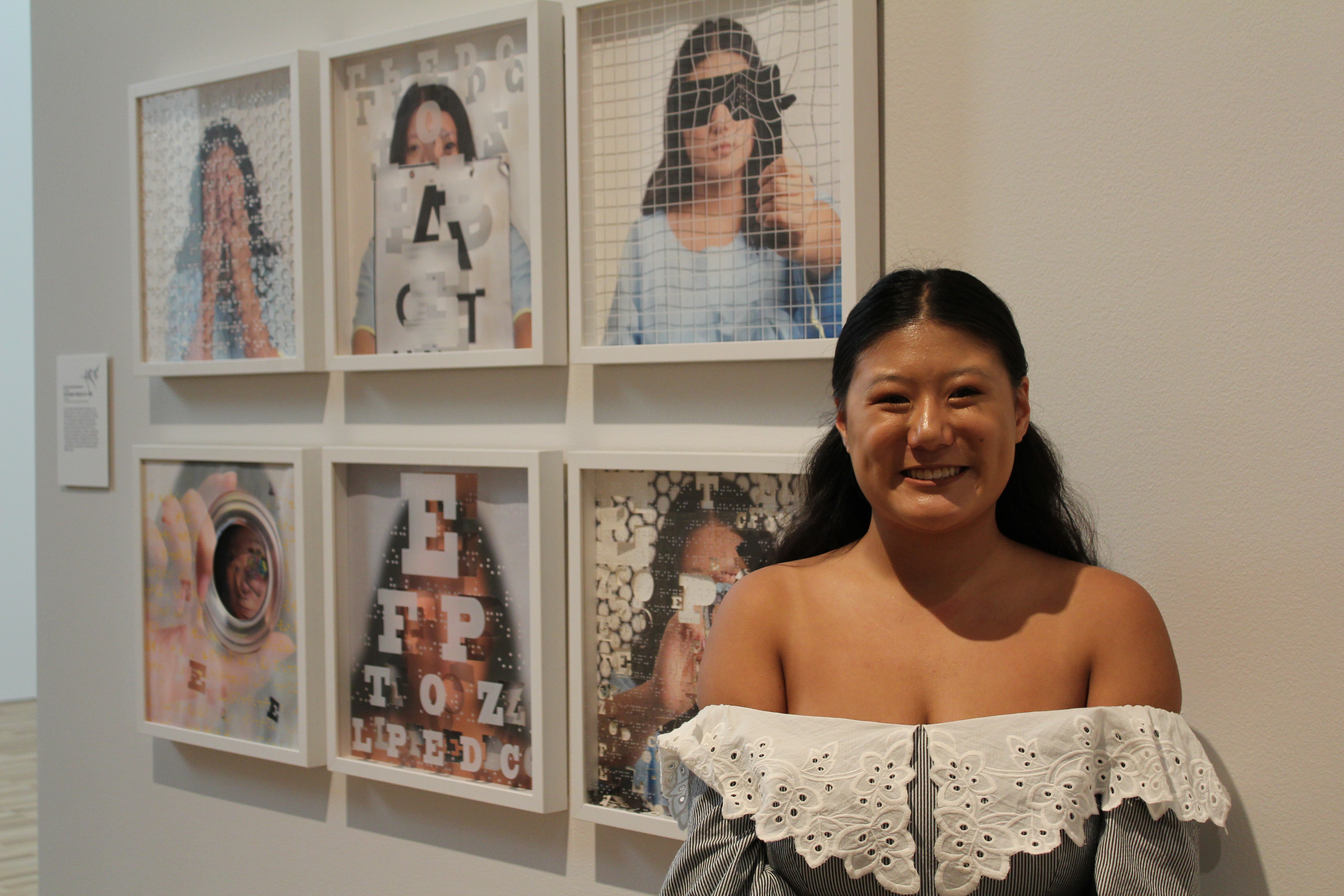 Mia standing in front of her work at the Art Gallery of NSW