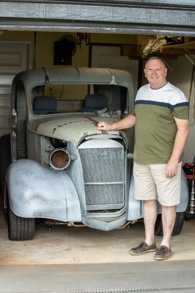 Paul with beloved hot rod he continues to restore.