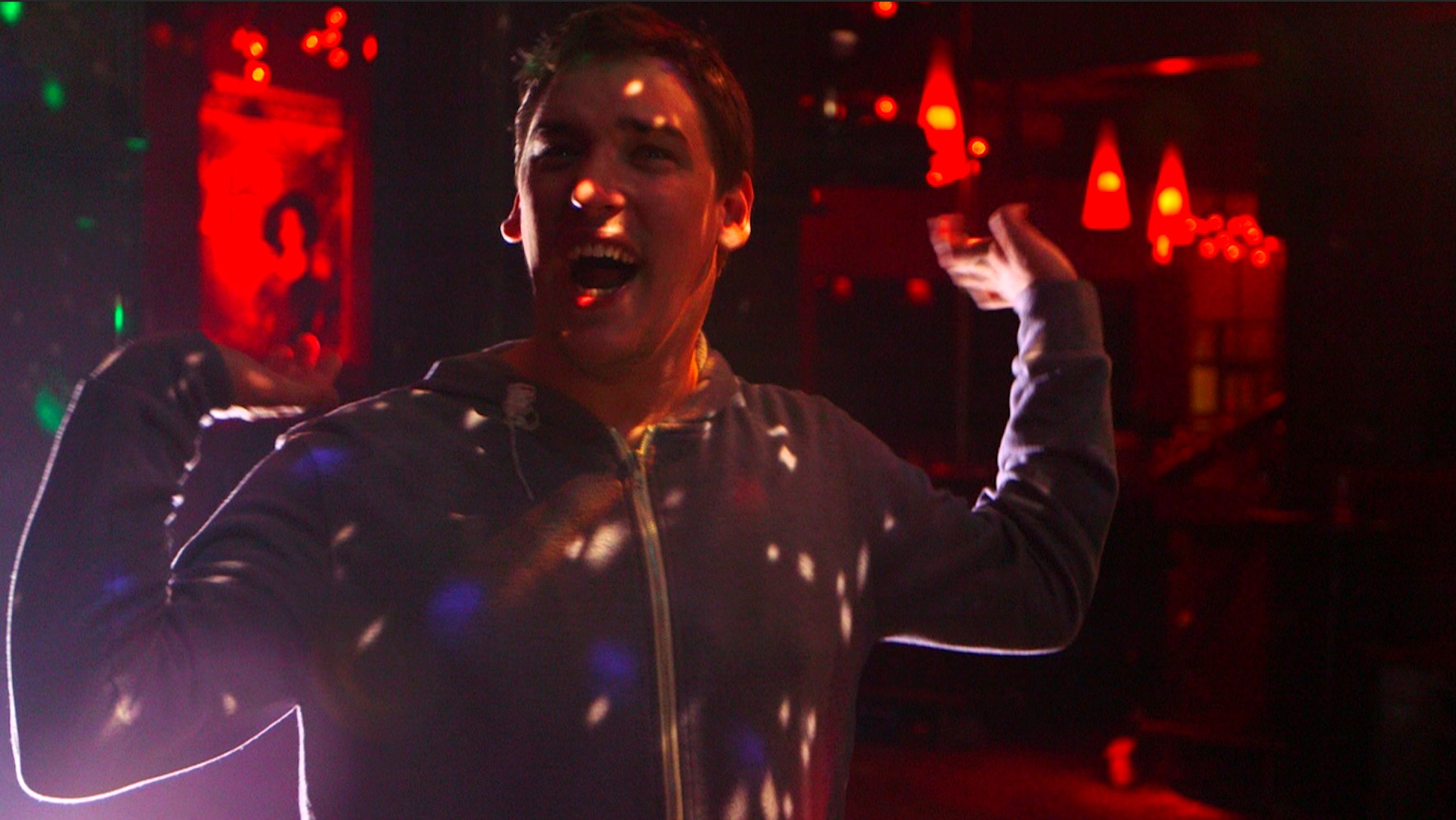 A still from the film: Thomas dancing in a club