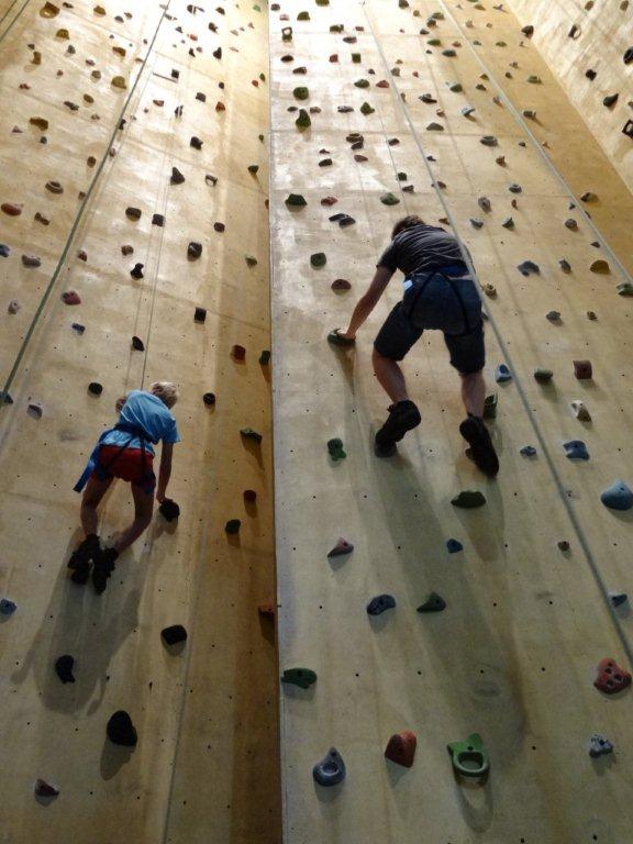 Picture of children climbing wall.