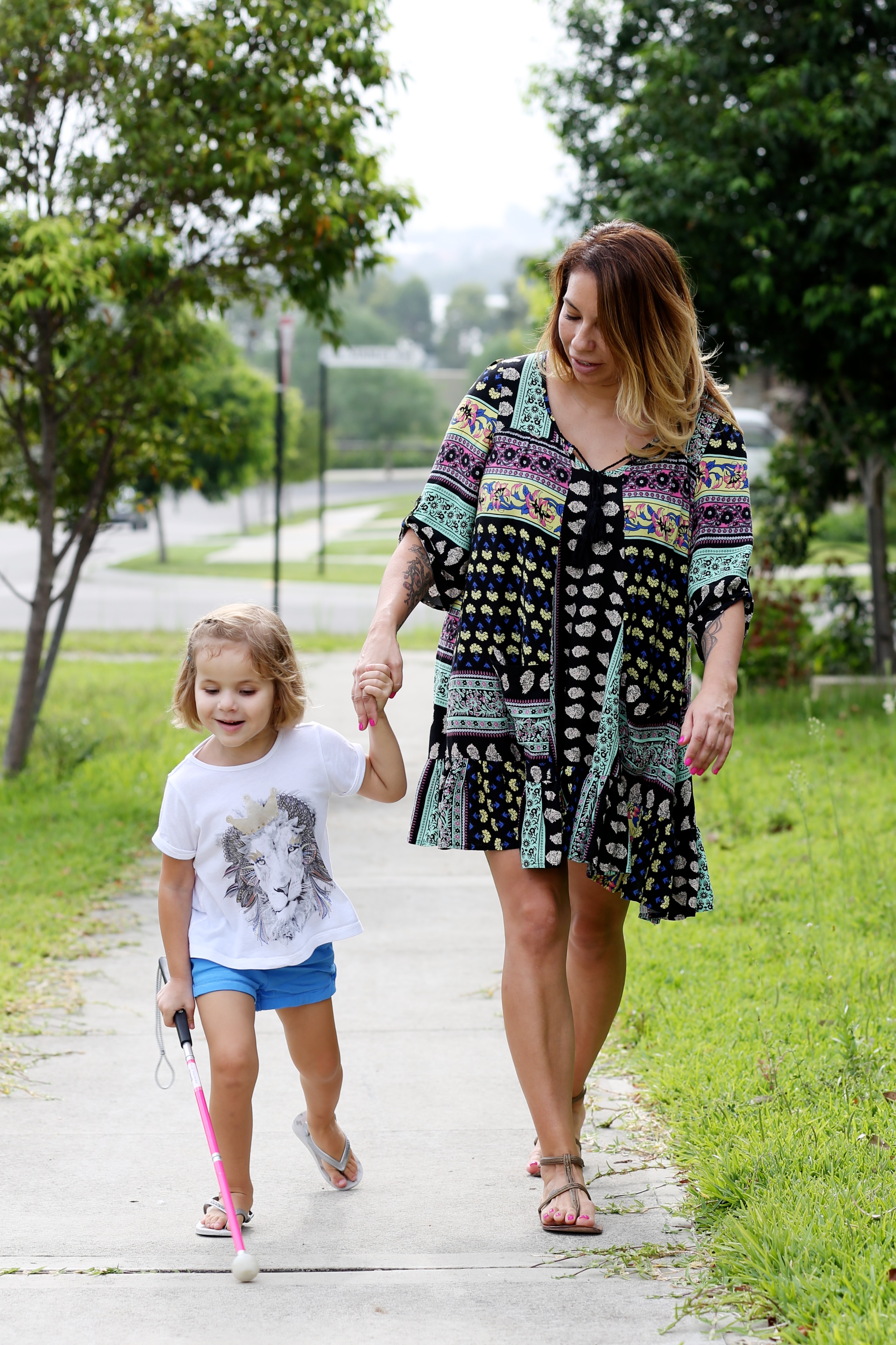 Kaylah walking with her cane