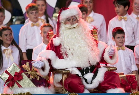 Actor Terry Gills performs as Santa Claus, on stage at Carols by Candlelight in 2014.
