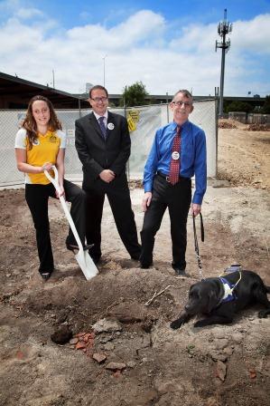 Prue Watt turning the soil with shovel, along side Warwick Ponder of eftpos and Kevin Murfitt of Vision Australia, at the SEDA redevelopment site.
