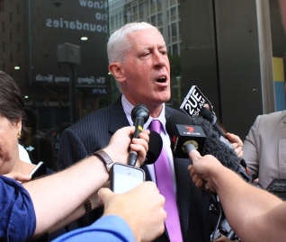 Profile shot of Graeme speaking to media outside the court