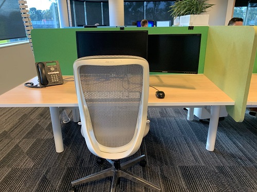 A workstation at A VA office with dual monitor screens