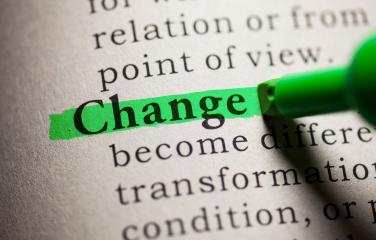 The word "change" written in typeface, and highlighted in green highlighter